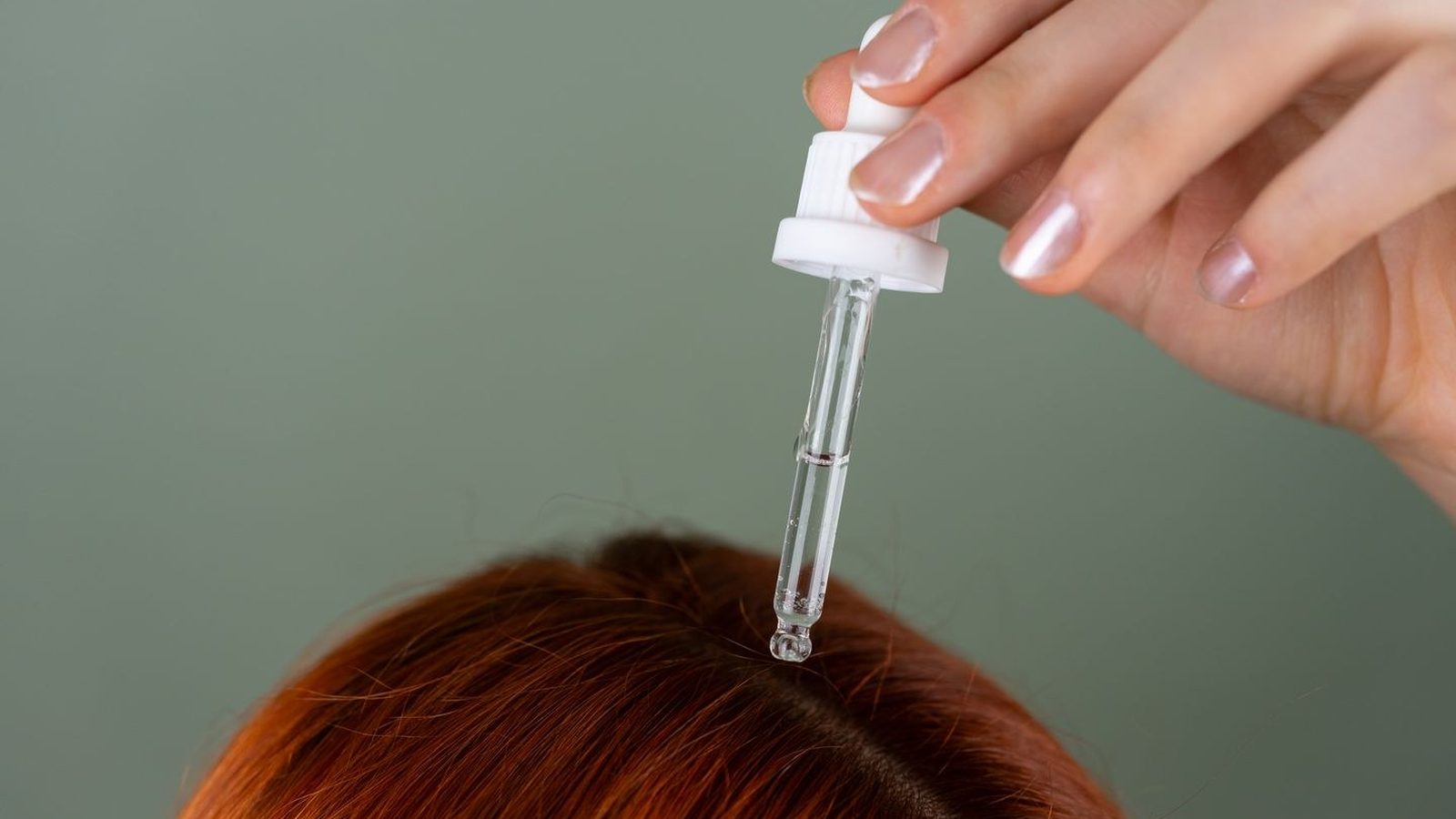 Clinician preparing a platelet-rich plasma injection at the scalp for hair restoration